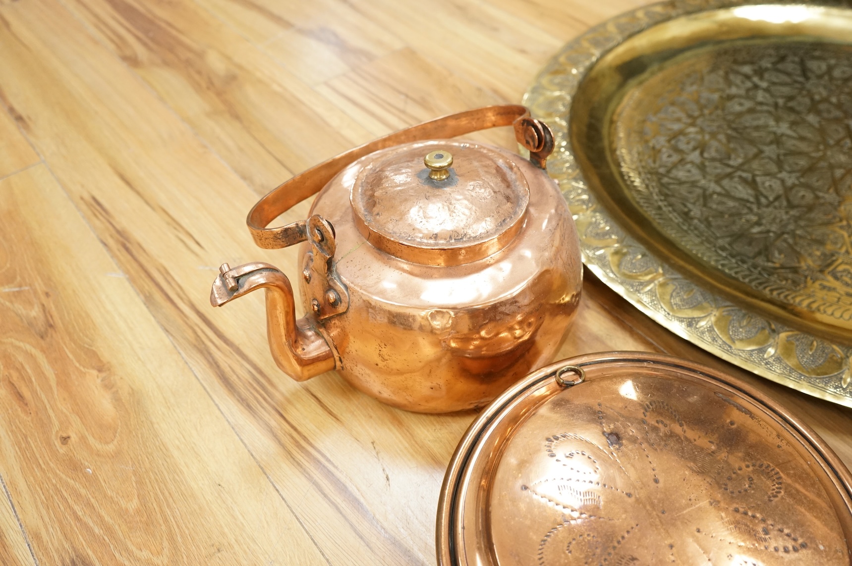 A group of metalware to include brass trays and copper warming pans